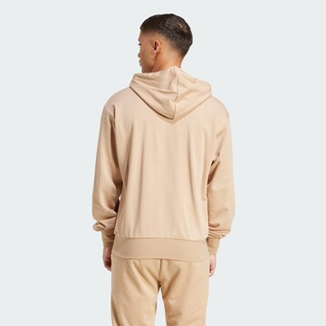 ADIDAS SPORTSWEAR Sports sweatshirt 'Essentials Feelcozy' in Brown