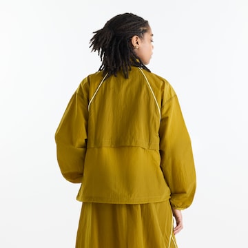 new balance - Chaqueta deportiva 'Sport Legacy Jacket' en amarillo