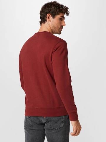 LEVI'S ®Regular Fit Sweater majica 'Original Housemark' - crvena boja