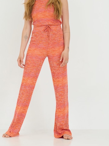 ABOUT YOU x Sofia Tsakiridou Loose fit Pants 'Lia' in Orange: front