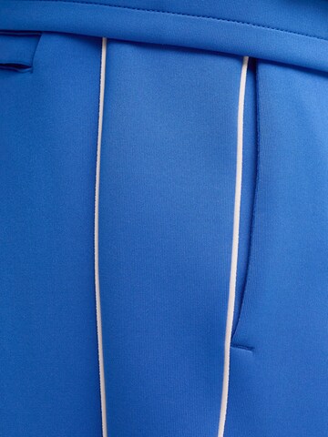 PUMA Regular Workout Pants ' T7' in Blue