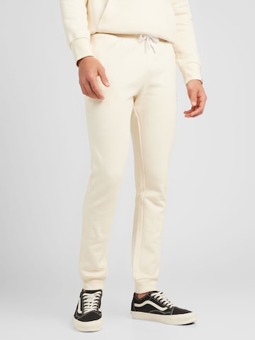 ELLESSE Tapered Pants in White: front