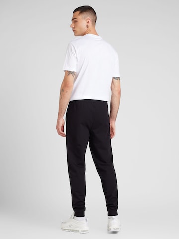 Tuta da jogging di EA7 Emporio Armani in nero