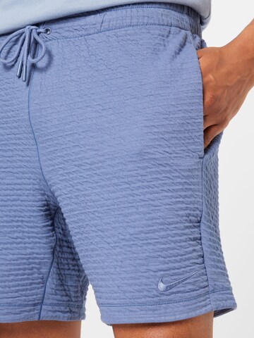 NIKE Regular Sports trousers in Blue