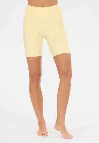 Athlecia Slim fit Sports trousers 'Blossom' in Yellow: front