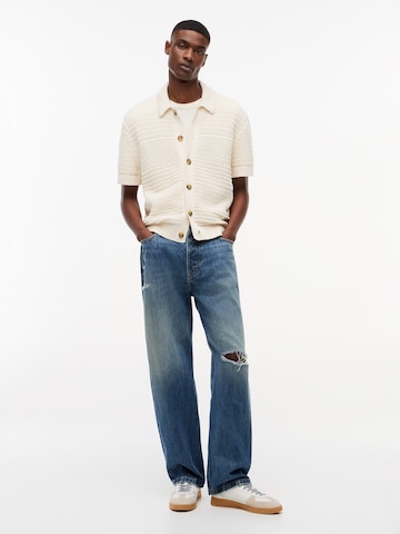 Tommy Jeans Neuletakki värissä beige