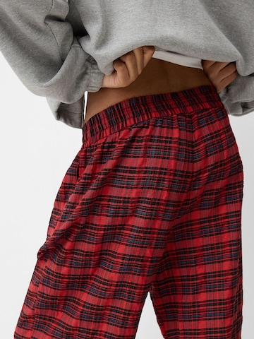 Bershka Loose fit Pleat-front trousers in Red
