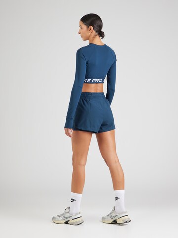 regular Pantaloni sportivi 'ONE' di NIKE in blu