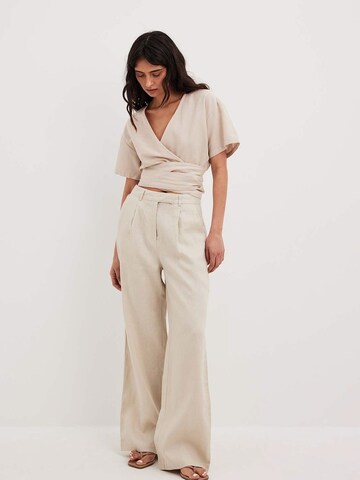 NA-KD Loose fit Pants in Beige: front