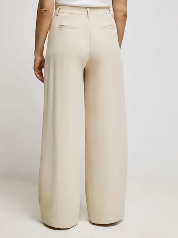 ABOUT YOU x Iconic by Tatiana Kucharova Loose fit Pleat-Front Pants 'Mathilda' in Beige