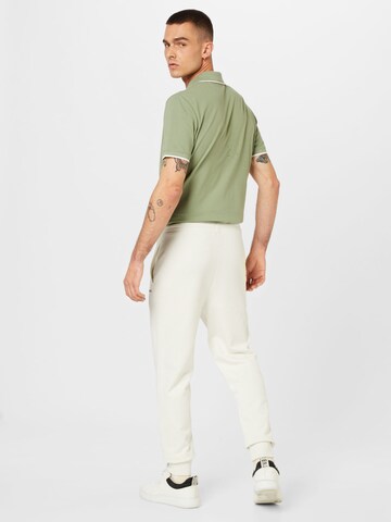 HUGO Zwężany krój Spodnie 'Dayote' w kolorze zielony