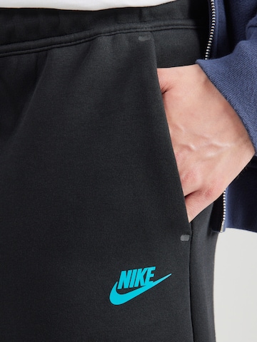 Regular Pantalon 'TCH FLC' Nike Sportswear en noir