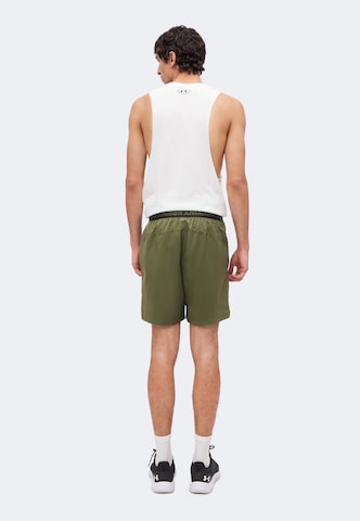 UNDER ARMOUR Regularen Športne hlače | zelena barva