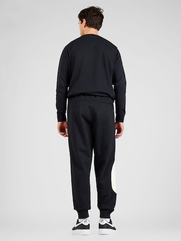 Nike Sportswear Дънки Tapered Leg Панталон в черно