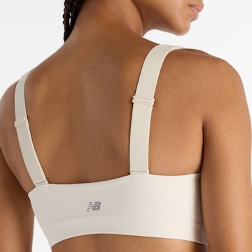 Bustino Reggiseno sportivo 'Harmon' di new balance in bianco