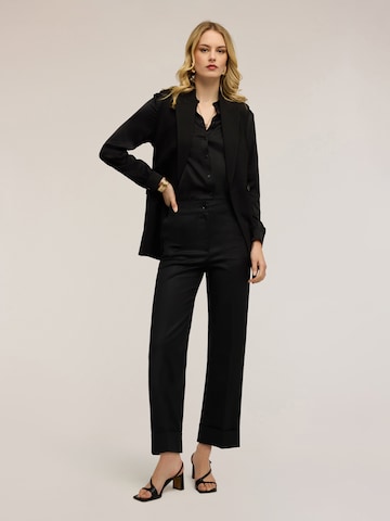 Wide leg Pantaloni di MOTIVI in nero