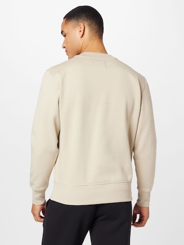 Calvin Klein Jeans Sweatshirt 'INSTITUTIONAL' in Beige
