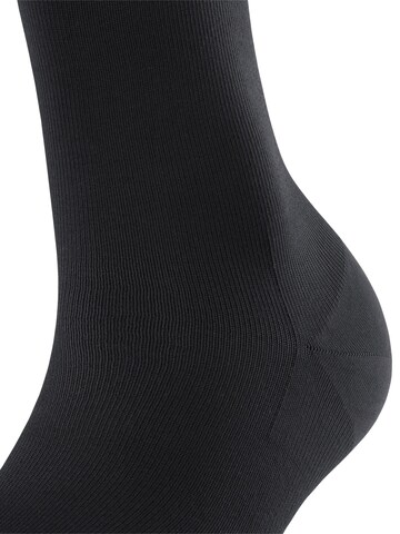 FALKE Overknee Strümpfe 'Energizer'‌‌‌‌‌‌‌‌‌‌ in Schwarz