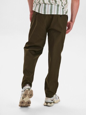 Dxnmxrk Tapered Hose 'DXElmo' in Grün