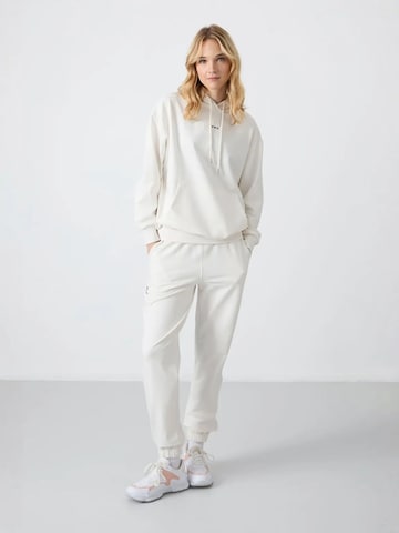 Tuta da jogging di Tommy Life in bianco: frontale
