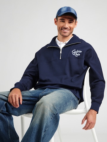 Sweat-shirt Calvin Klein Jeans en bleu : devant