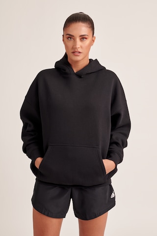 ABOUT YOU x Antonia Sweatshirt 'Kaili' in Black: front