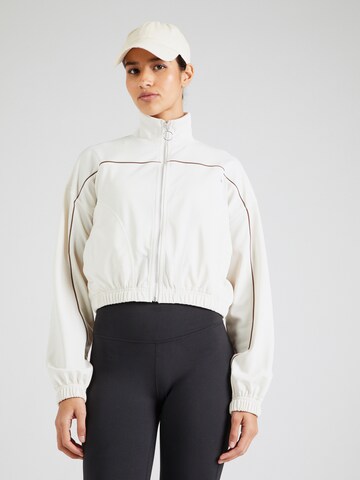 Veste de survêtement Reebok en beige : devant