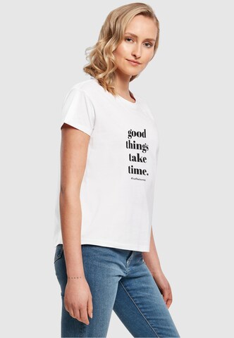 Merchcode T-Shirt 'Good Things Take Time' in Weiß