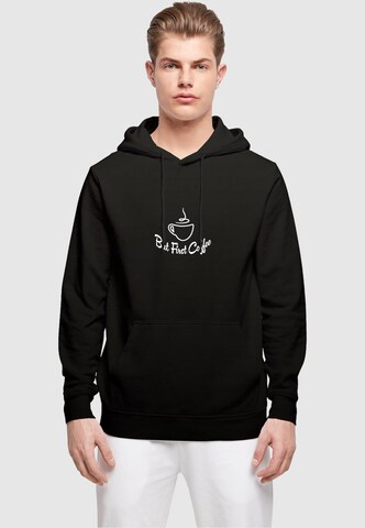 Sweat-shirt 'But First Coffee' Merchcode en noir : devant
