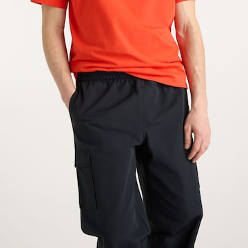 new balance Loosefit Hose in Schwarz