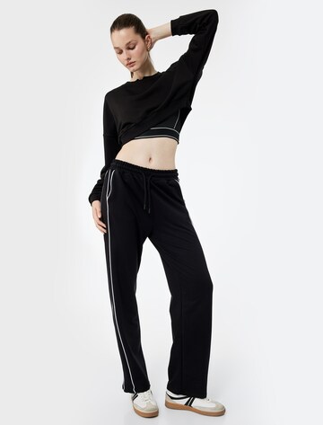 Koton Flared Pants in Black: front