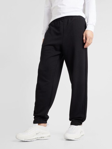 Champion Authentic Athletic Apparel Tapered Pants in Black: front