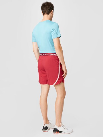 UNDER ARMOUR Regular Sports trousers in Red