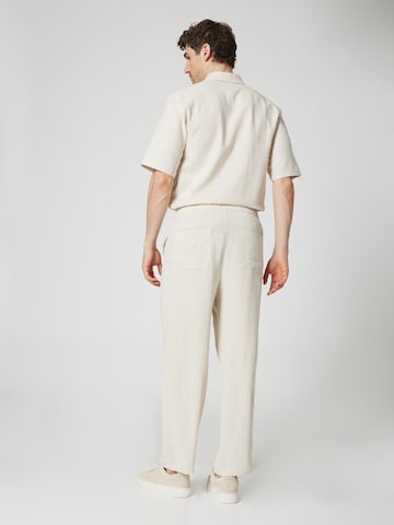 ABOUT YOU x Kevin Trapp Loose fit Trousers 'Kalle' in Beige