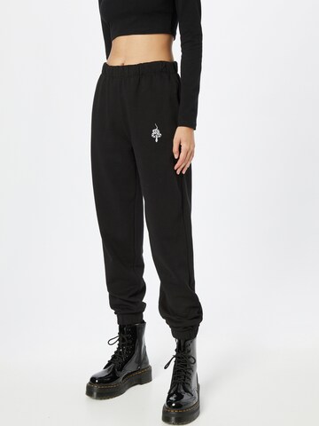 ABOUT YOU x INNA Tapered Pants 'Sandra' in Black: front