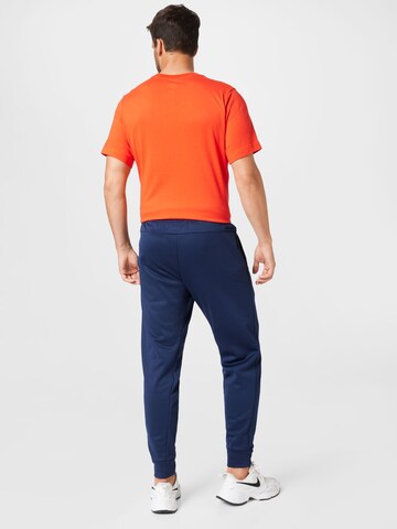 NIKE Tapered Sportbroek in Blauw