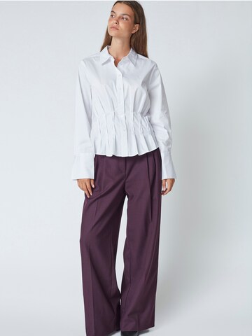 Chemisier 'Poppy' co'couture en blanc