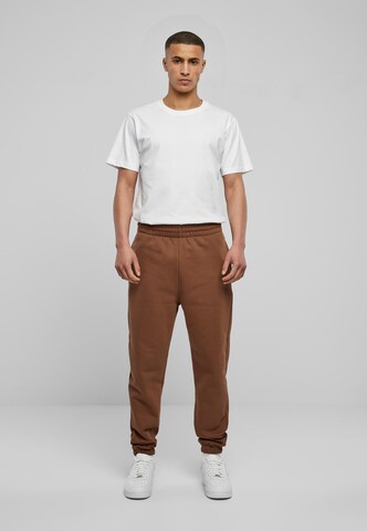 Tapered Pantaloni di Urban Classics in marrone