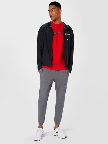 NIKE Tapered Sportbyxa i grå