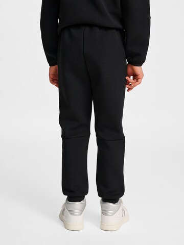 Effilé Pantalon de sport Hummel en noir