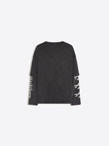 Tricou 'BLACKTHORN' de la Bershka pe negru