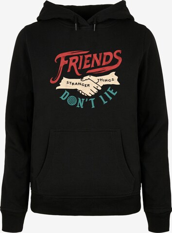 ABSOLUTE CULT Sweatshirt 'Stranger Things - Friends Dont Lie Hands' in Zwart: voorkant