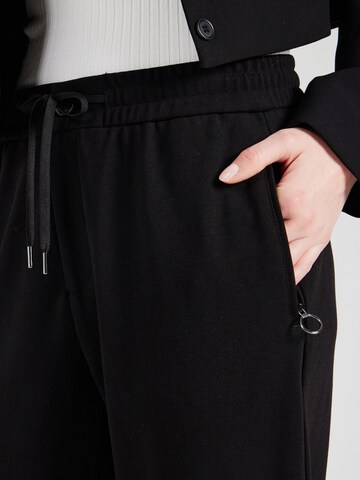 Tapered Pantaloni di s.Oliver in nero