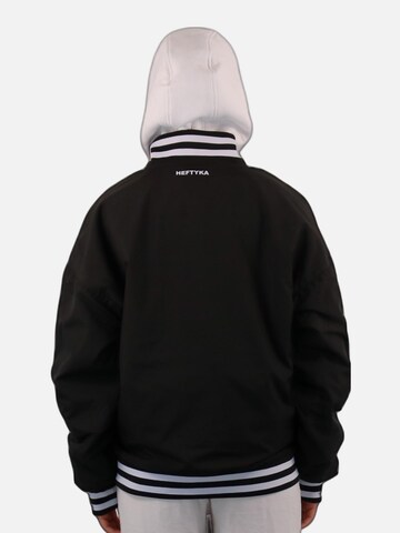 HEFTYKA Übergangsjacke‌‌‌ in Schwarz