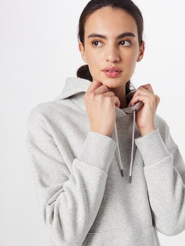 UNDER ARMOUR Sports sweatshirt 'Essential' in Grey