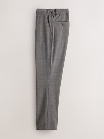 Slimfit Pantaloni con piega frontale 'Motionflex' di Next in marrone