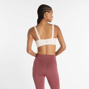 Bustino Reggiseno sportivo 'Harmon' di new balance in bianco