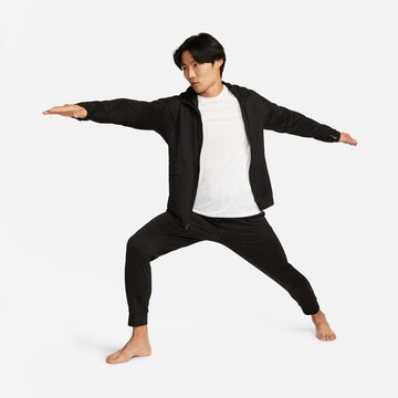 NIKE Tapered Sports trousers in Black