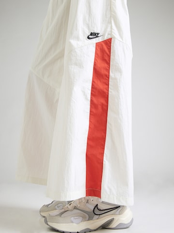 Nike Sportswear Široký strih Nohavice - Béžová
