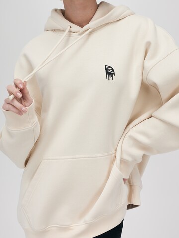 UNFOLLOWED x ABOUT YOU Sweatshirt 'STRONG' in Beige